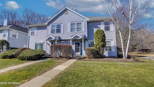 view of front of home with a front lawn