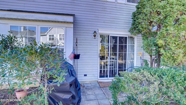 doorway to property featuring a patio