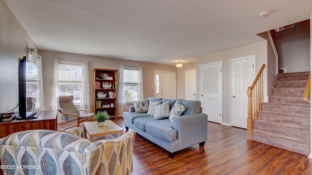 living room with stairway and wood finished floors