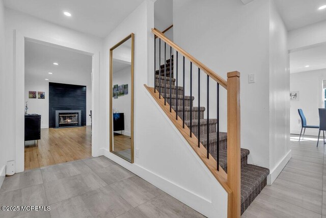 1158 Idalia Ave, Lakewood, NJ 08701 - stairs with recessed lighting, baseboards, and a large fireplace