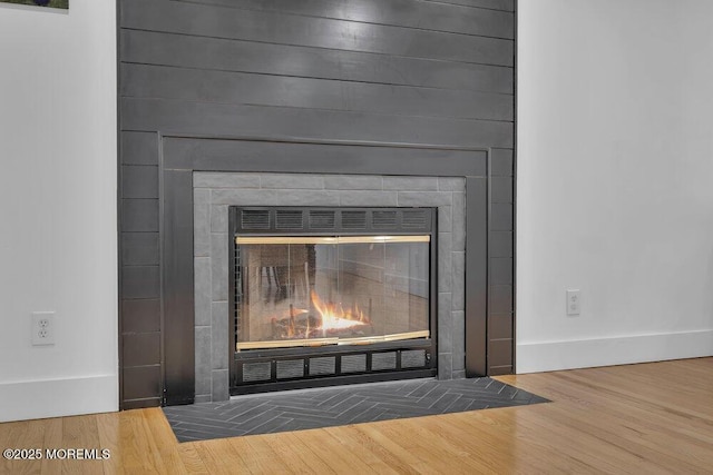 1158 Idalia Ave, Lakewood, NJ 08701 - room details featuring wood finished floors, baseboards, and a large fireplace