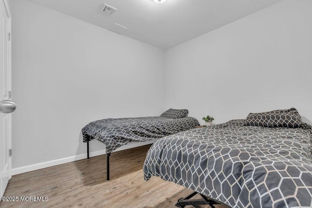1158 Idalia Ave, Lakewood, NJ 08701 - bedroom with wood finished floors, visible vents, and baseboards
