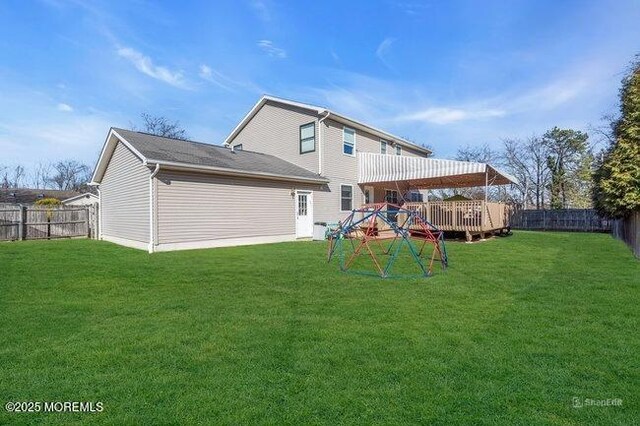 1158 Idalia Ave, Lakewood, NJ 08701 - rear view of house with a lawn, a fenced backyard, and a wooden deck