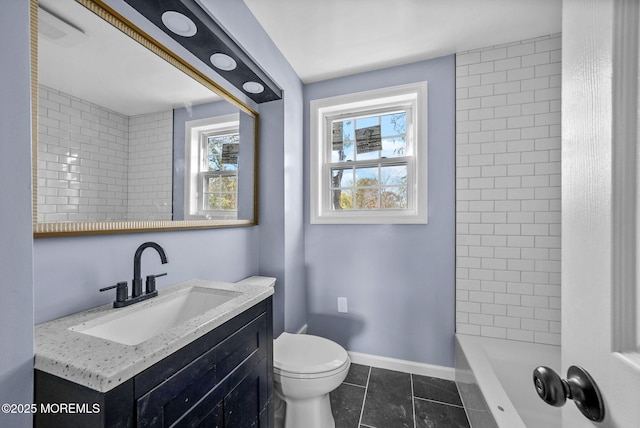 full bathroom with baseboards, toilet, a bathtub, tile patterned floors, and vanity