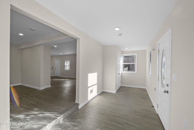 foyer entrance with recessed lighting, wood finished floors, and baseboards