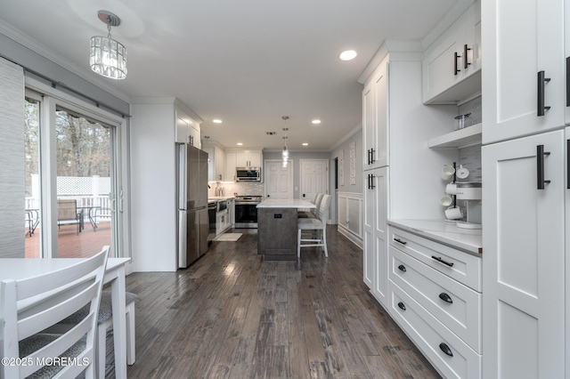 kitchen featuring white cabinetry, light countertops, open shelves, and appliances with stainless steel finishes