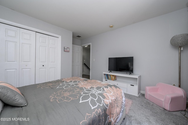 bedroom with a closet and carpet floors