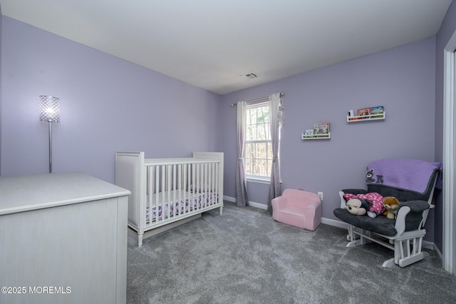 carpeted bedroom featuring a nursery area, baseboards, and visible vents