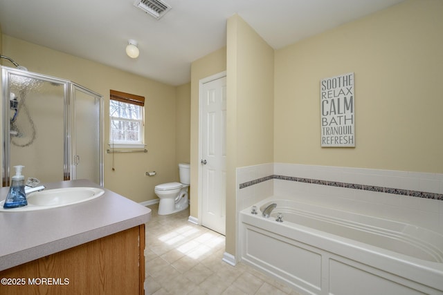 bathroom featuring visible vents, toilet, a shower stall, a bath, and vanity