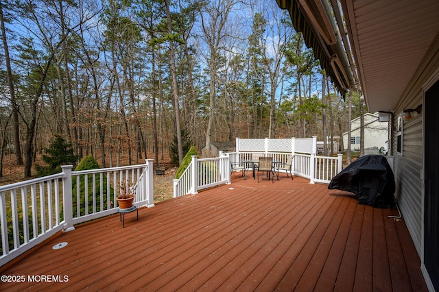 deck featuring outdoor dining area