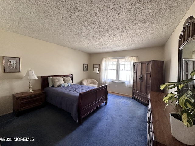 bedroom featuring a textured ceiling, baseboards, and dark colored carpet