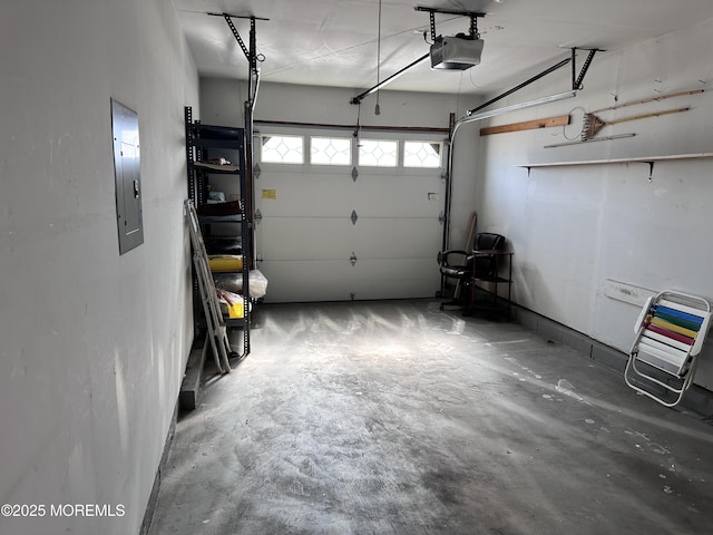 garage with electric panel and a garage door opener