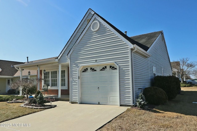 exterior space featuring brick siding, driveway, and a garage