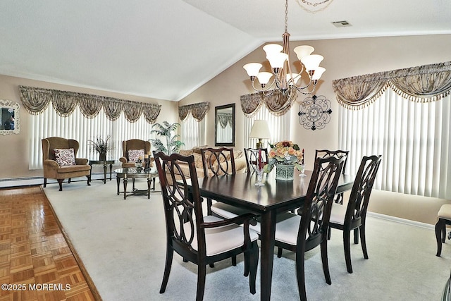 dining room featuring a notable chandelier, a baseboard radiator, visible vents, and vaulted ceiling