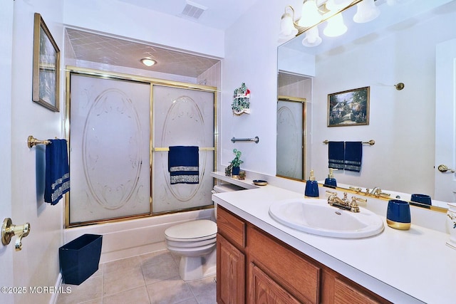 full bath featuring tile patterned floors, visible vents, toilet, shower / bath combination with glass door, and vanity