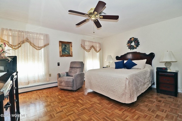 bedroom featuring baseboard heating and a ceiling fan