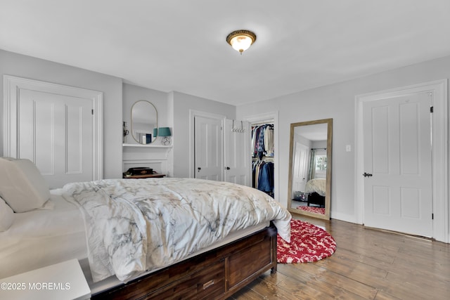 bedroom featuring a closet and wood finished floors