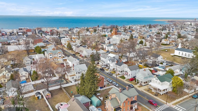 birds eye view of property with a residential view and a water view