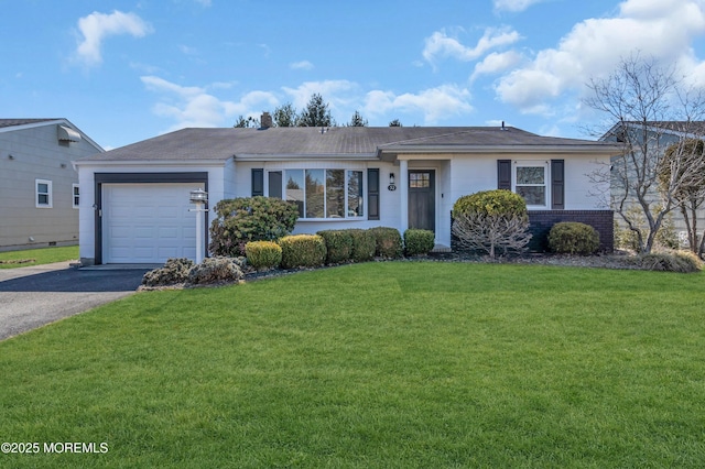 ranch-style house featuring aphalt driveway, a front lawn, brick siding, and a garage