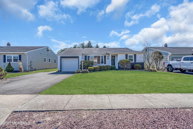 ranch-style house with a front lawn, a garage, and driveway