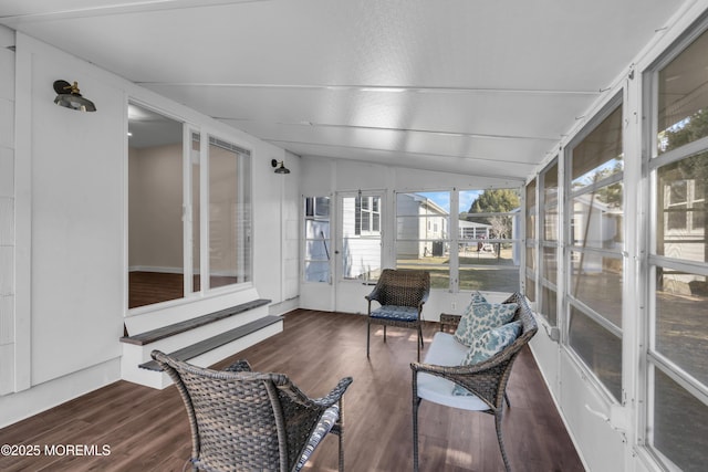 sunroom featuring vaulted ceiling