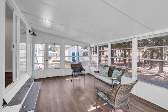 unfurnished sunroom with lofted ceiling