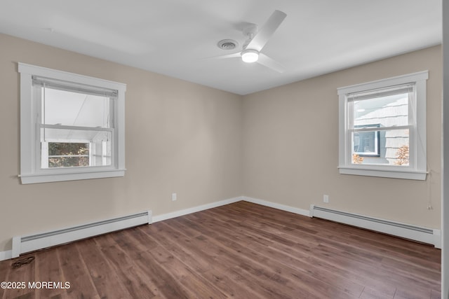 unfurnished room featuring baseboards, wood finished floors, ceiling fan, and a baseboard radiator