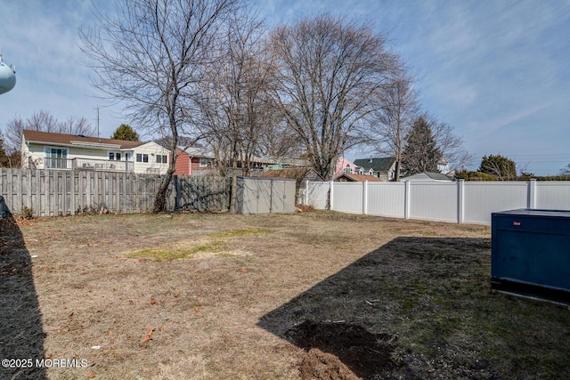 view of yard with a fenced backyard