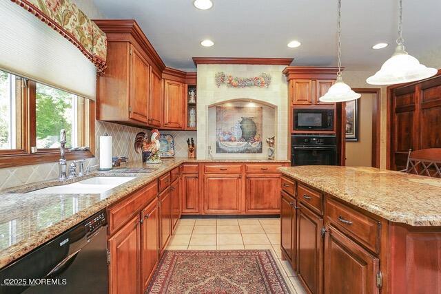 kitchen featuring light stone countertops, light tile patterned flooring, a sink, decorative backsplash, and black appliances