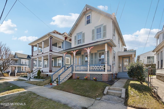 view of front of house featuring a porch and a front yard