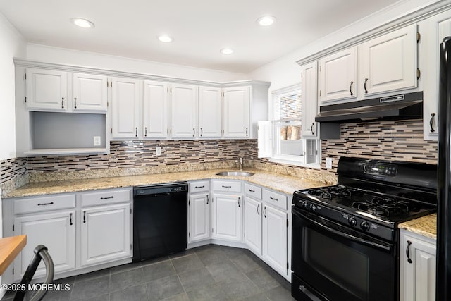 kitchen featuring under cabinet range hood, white cabinetry, black appliances, and a sink