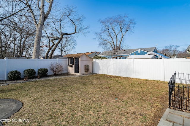 view of yard featuring an outbuilding and a fenced backyard