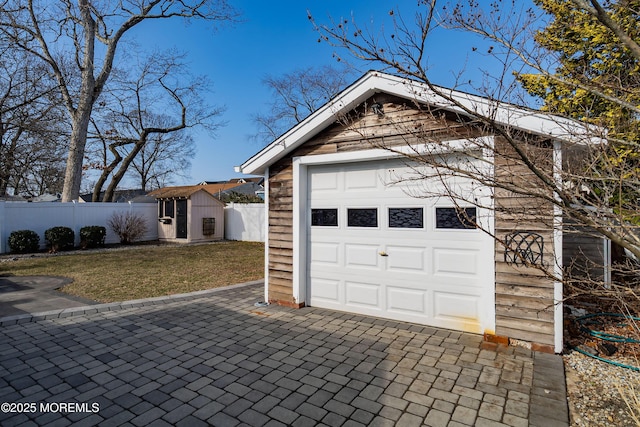 garage with fence