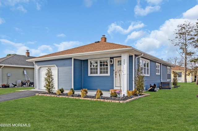 view of front of property featuring driveway, a front yard, a chimney, and an attached garage