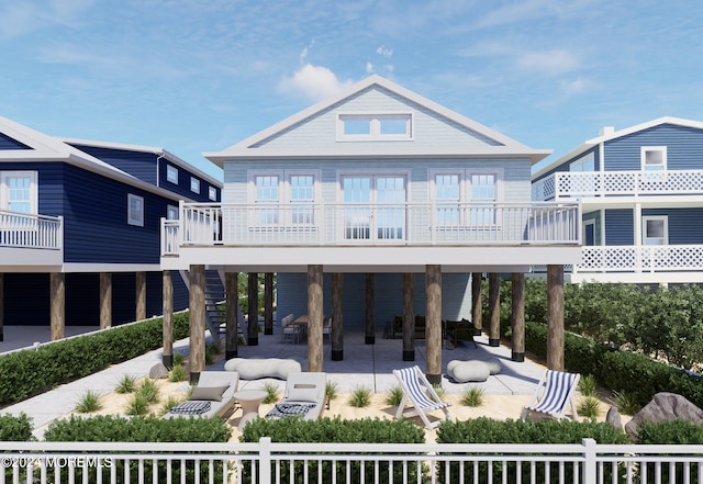 rear view of house featuring stairway and a patio