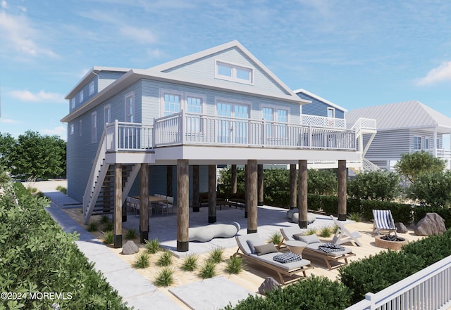 rear view of house featuring a patio area, an outdoor fire pit, and stairs