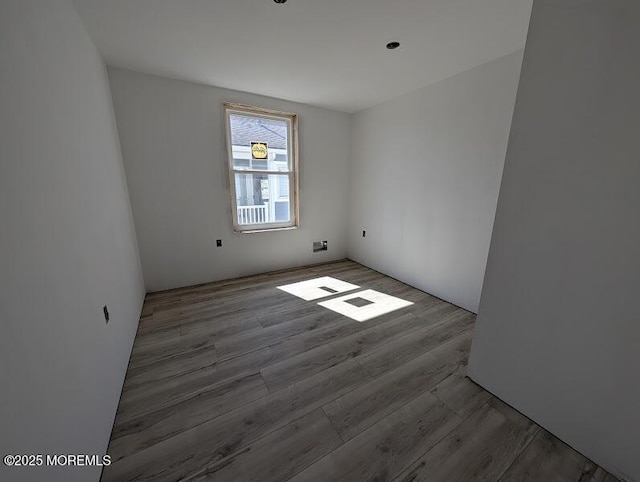 empty room with wood finished floors