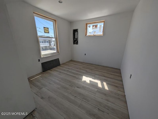 unfurnished room with wood finished floors