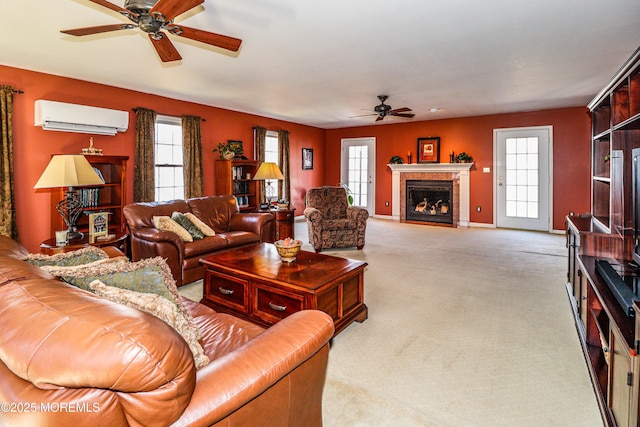 carpeted living area featuring a fireplace with flush hearth, a ceiling fan, baseboards, and a wall mounted air conditioner