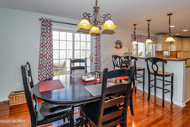 dining area with recessed lighting and light wood-style floors