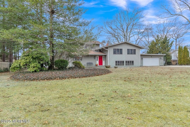 tri-level home with a front yard and a garage