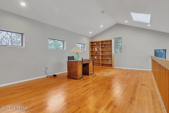 office space featuring visible vents, baseboards, light wood-type flooring, vaulted ceiling, and recessed lighting