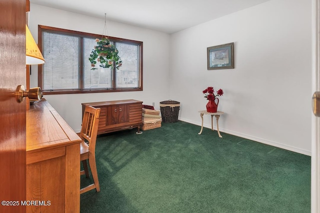 interior space featuring baseboards and dark colored carpet