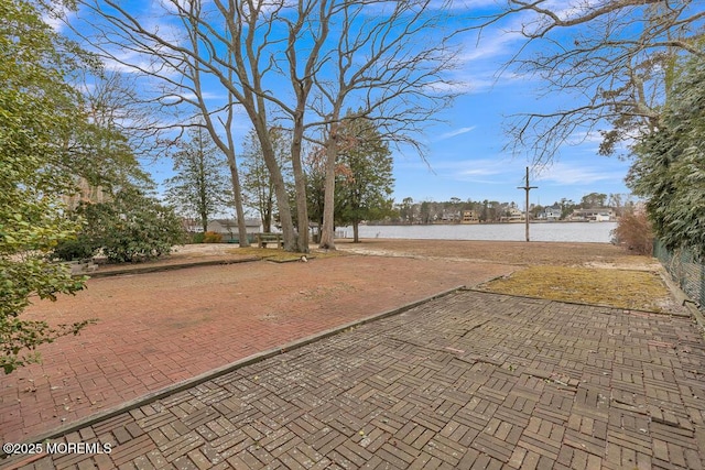 view of patio / terrace with a water view