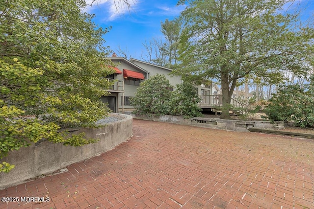 view of home's community with a wooden deck