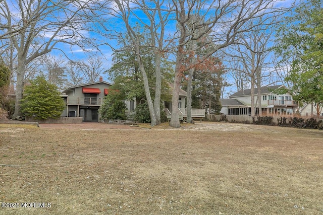 exterior space featuring a chimney and a front lawn