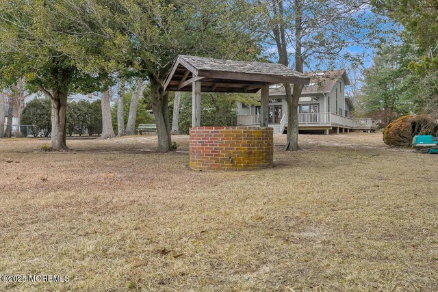 view of yard featuring a gazebo and a deck