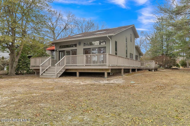 view of front of property with a wooden deck