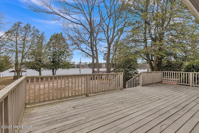 deck featuring a water view