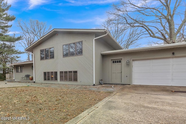 view of front of property with driveway and an attached garage